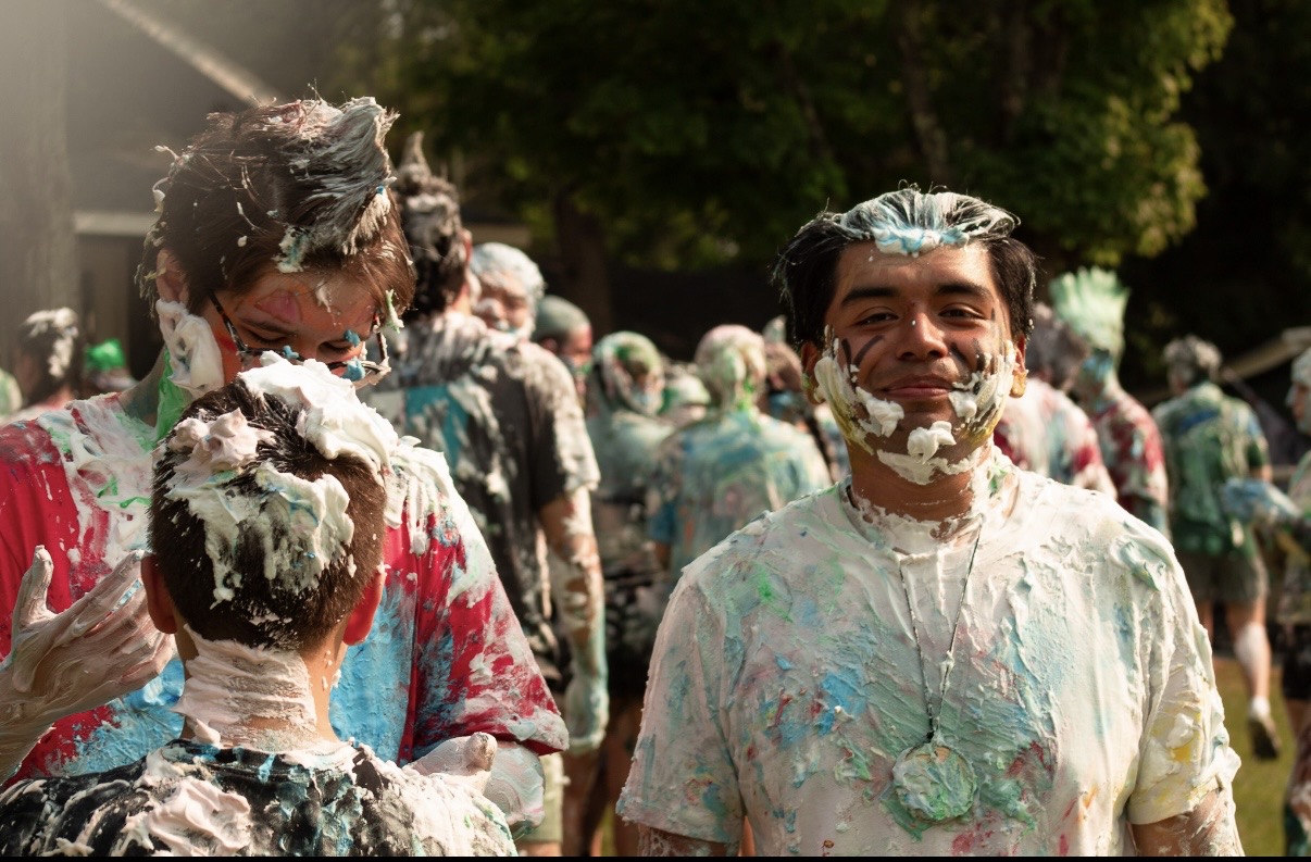 Camp participants covered in colorful foam